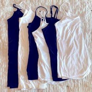 Mix of black and white camisoles. All medium. Some differing in length.